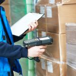 Worker man scanning package in warehouse | racking inspection training course