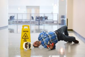a worker fallen on a wet floor